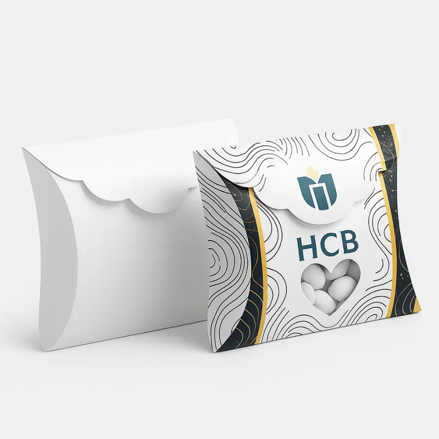 White pillow boxes- one with a wavy pattern- heart-shaped window- and candy inside- class=